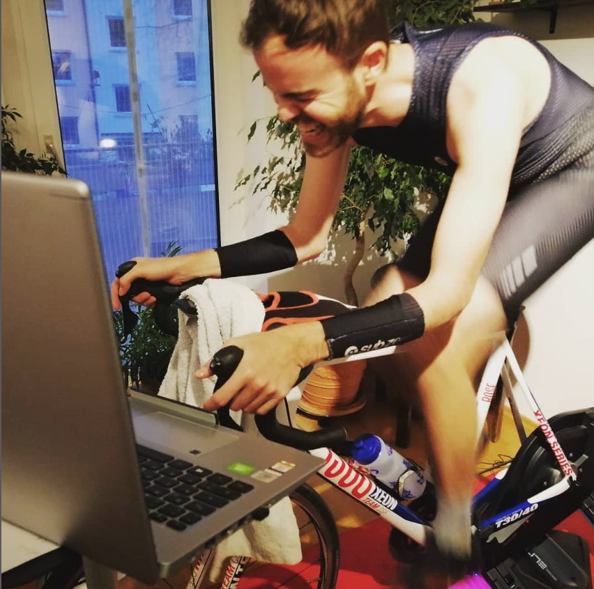 Man training on indoor trainer with great effort